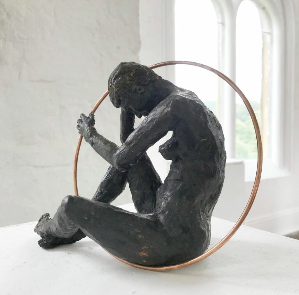Sculpture created in clay, fired and hand coloured.